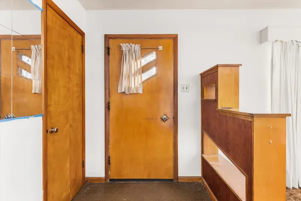 a view of a livingroom with an empty space and workspace