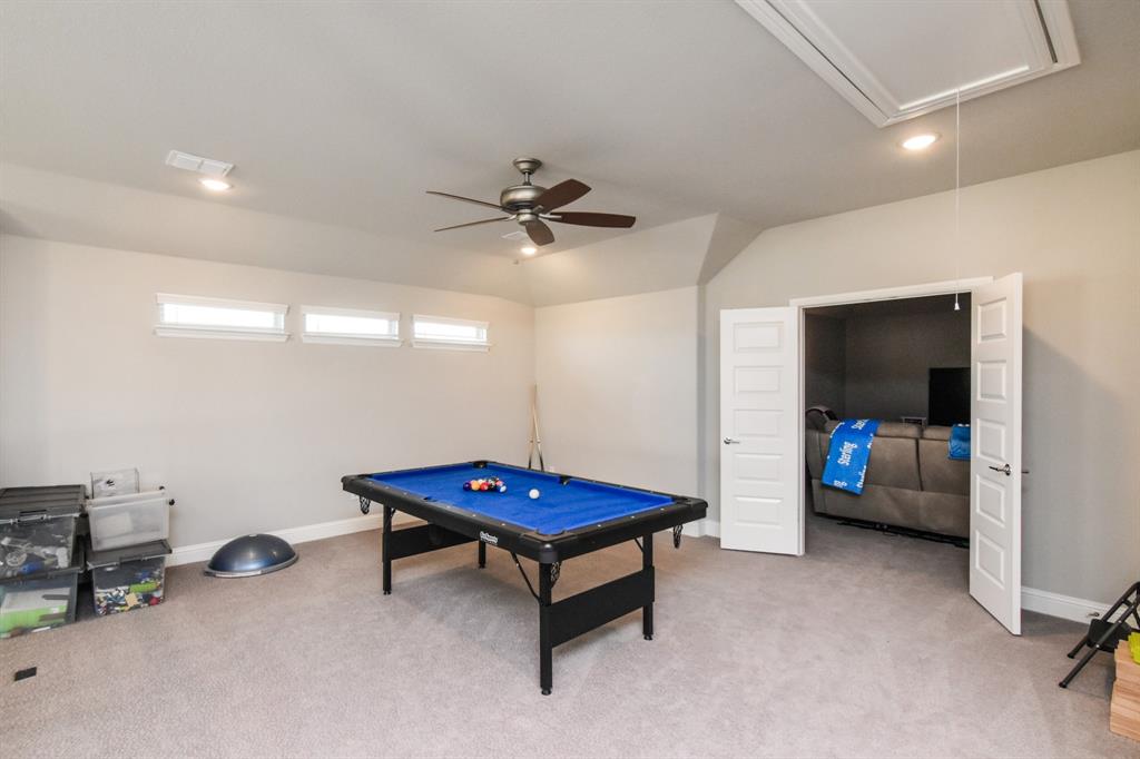 2516 Maidenhair Road Frisco, TX 75033 - Photo 17 of 30 a living room with furniture and a flat screen tv