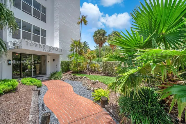 a wooden bench sitting in front of a building