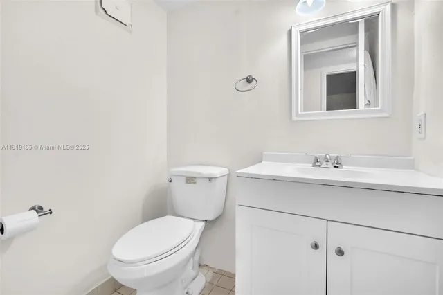a bathroom with a sink toilet and vanity