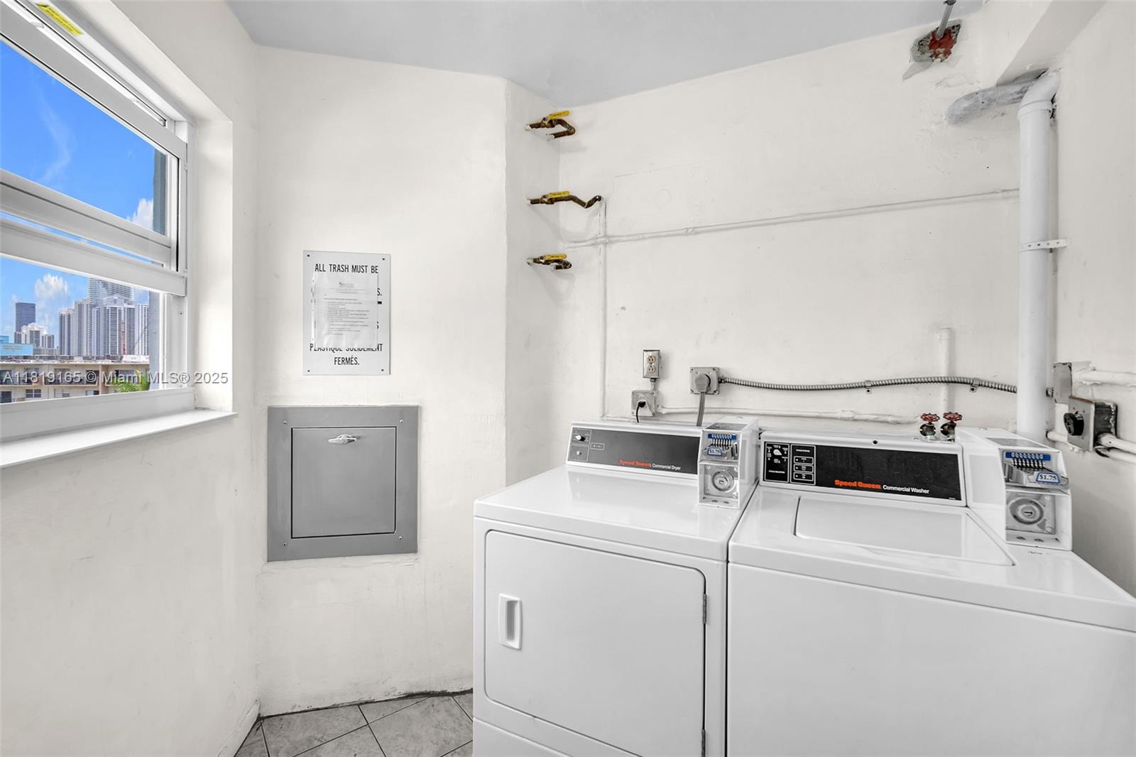 17800 Atlantic Boulevard, Unit 303 Sunny Isles Beach, FL 33160 - Photo 20 of 26 a utility room with dryer and washer