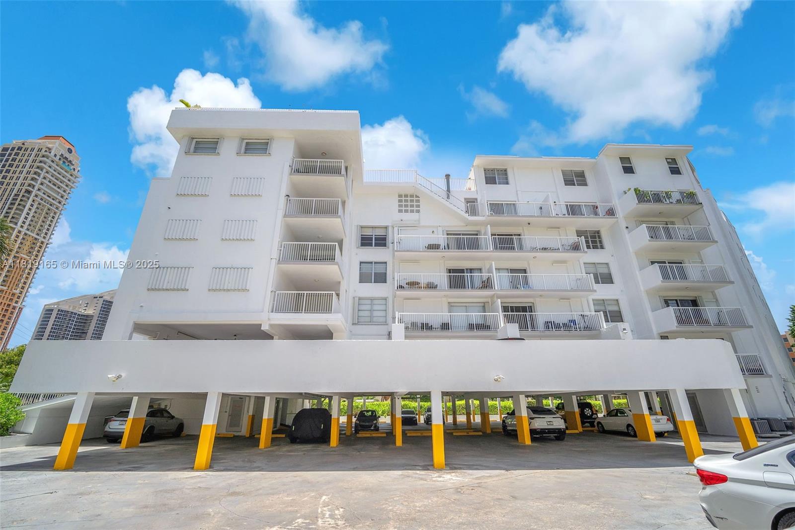 17800 Atlantic Boulevard, Unit 303 Sunny Isles Beach, FL 33160 - Photo 22 of 26 a front view of a building with outdoor space