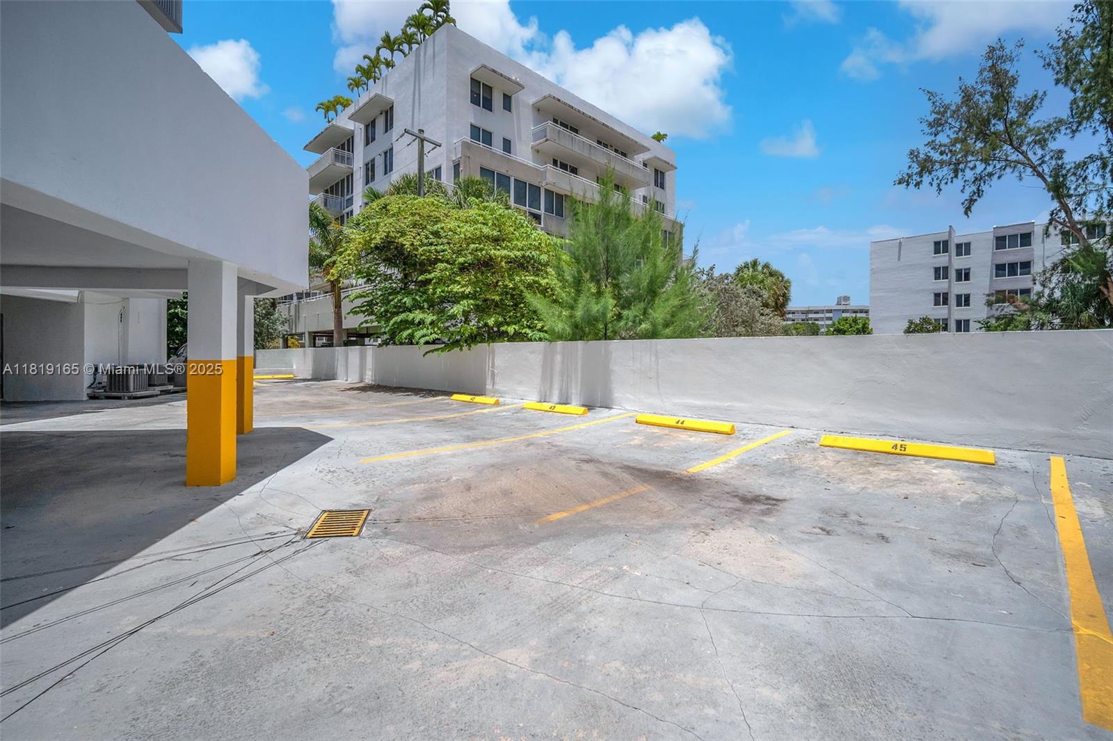 17800 Atlantic Boulevard, Unit 303 Sunny Isles Beach, FL 33160 - Photo 23 of 26 a view of a swimming pool with an outdoor space and seating area