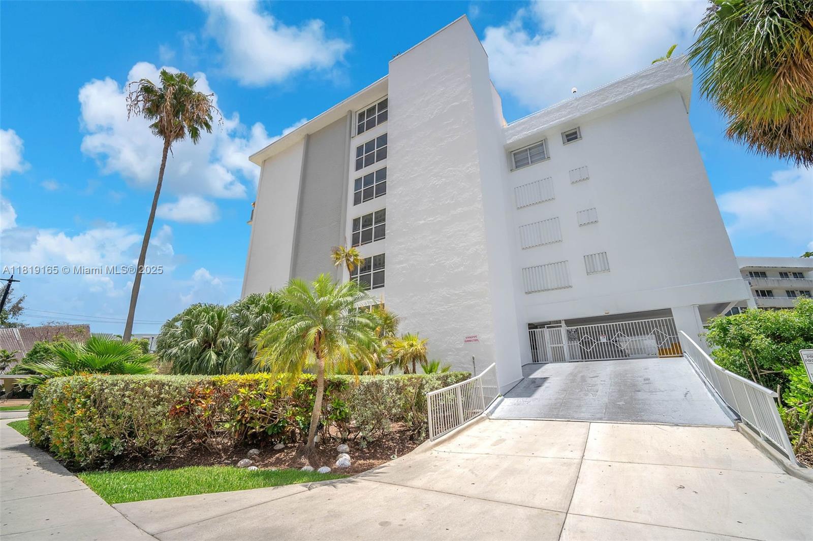 17800 Atlantic Boulevard, Unit 303 Sunny Isles Beach, FL 33160 - Photo 24 of 26 a view of a back yard of the house