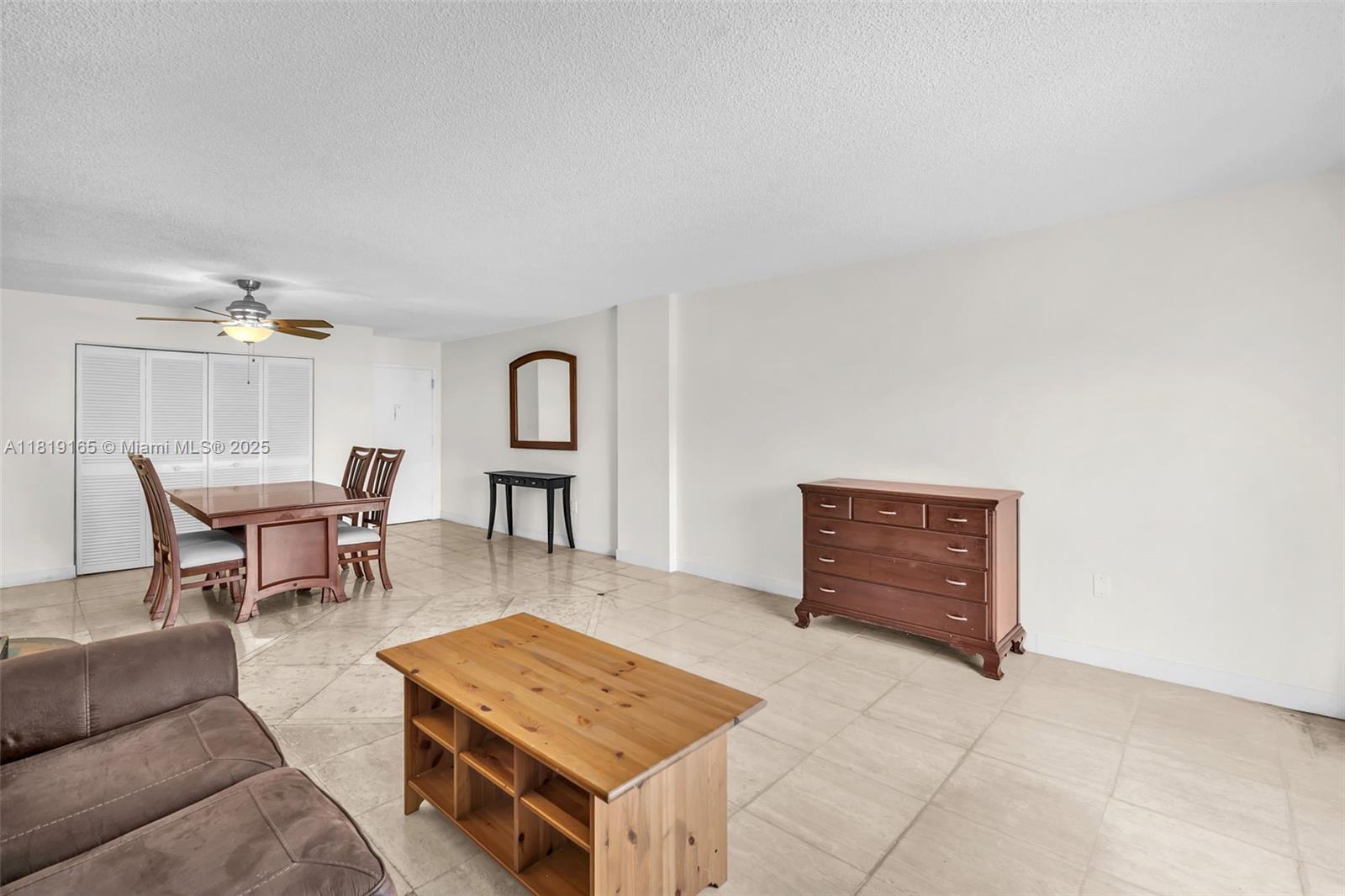17800 Atlantic Boulevard, Unit 303 Sunny Isles Beach, FL 33160 - Photo 4 of 26 a living room with furniture
