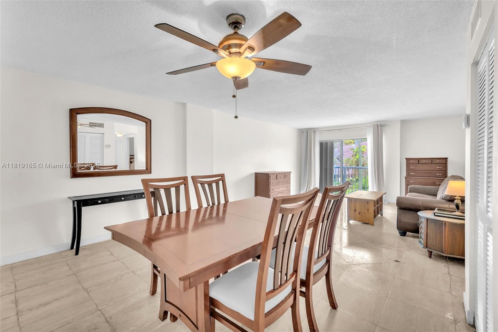 17800 Atlantic Boulevard, Unit 303 Sunny Isles Beach, FL 33160 - Photo 7 of 26 a view of a livingroom with furniture