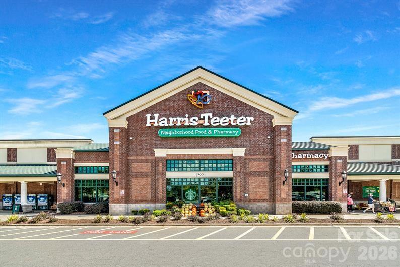 9557 Teamwork Street Northwest Concord, NC 28027 - Photo 21 of 23 a sign board on the side of a street