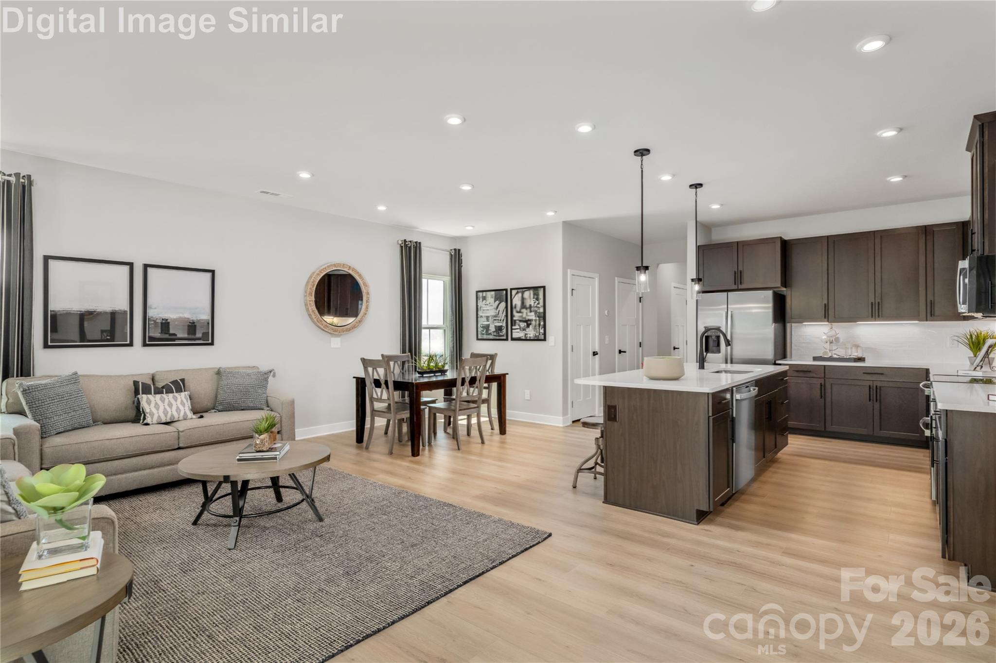9557 Teamwork Street Northwest Concord, NC 28027 - Photo 5 of 23 a living room with furniture and a large window