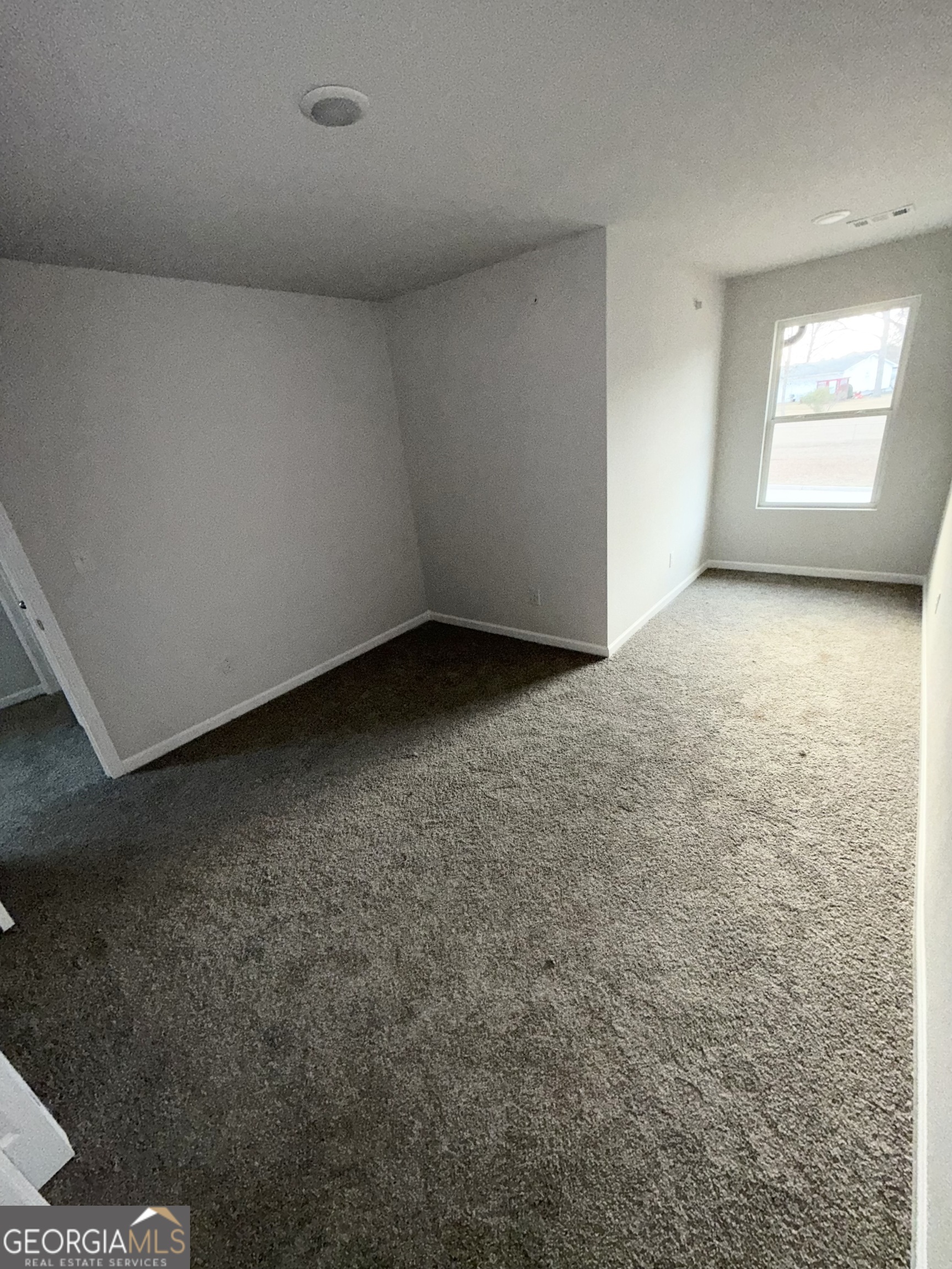 11602 East Lovejoy Road Hampton, GA 30228 - Photo 17 of 22 an empty room with a window