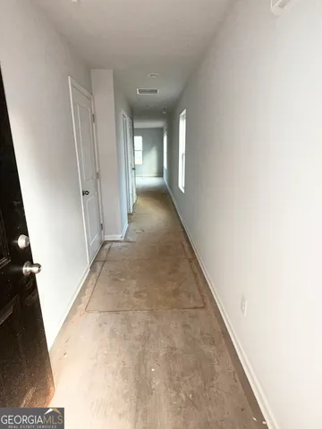 a bathroom with a granite countertop sink and a toilet