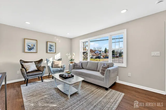 a living room with furniture and a rug