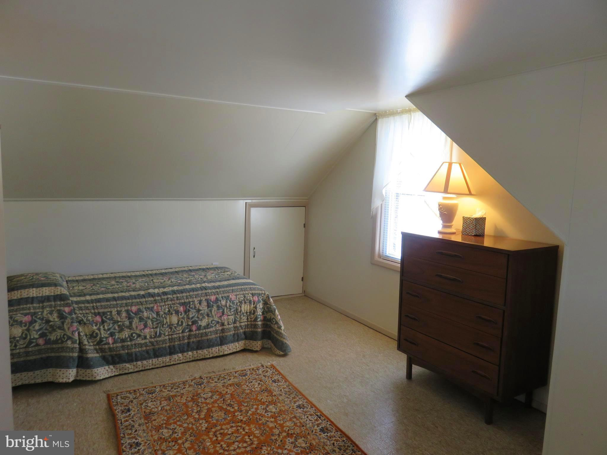1710 Orlando Road Baltimore, MD 21234 - Photo 18 of 32 a view of a bedroom with wooden floor and a window
