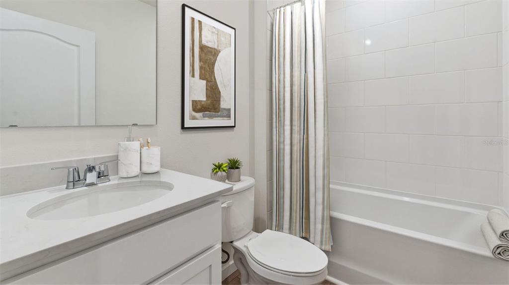 1024 Commons Way Port Port Orange, FL 32129 - Photo 16 of 17 a bathroom with a sink a toilet and shower