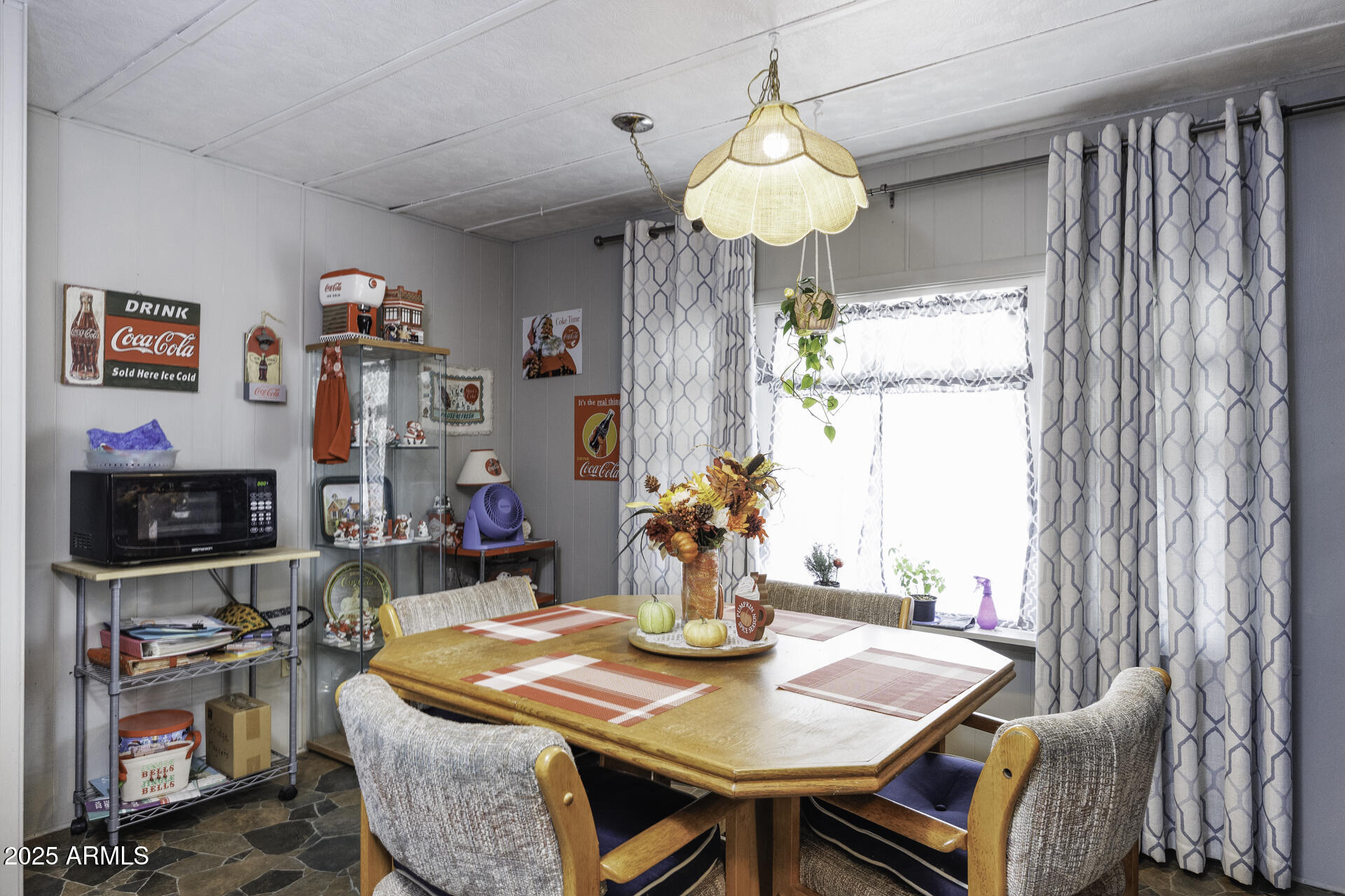2100 North Trekell Road, Unit 347 Casa Grande, AZ 85122 - Photo 12 of 38 a view of a dining room with furniture a chandelier and wooden floor