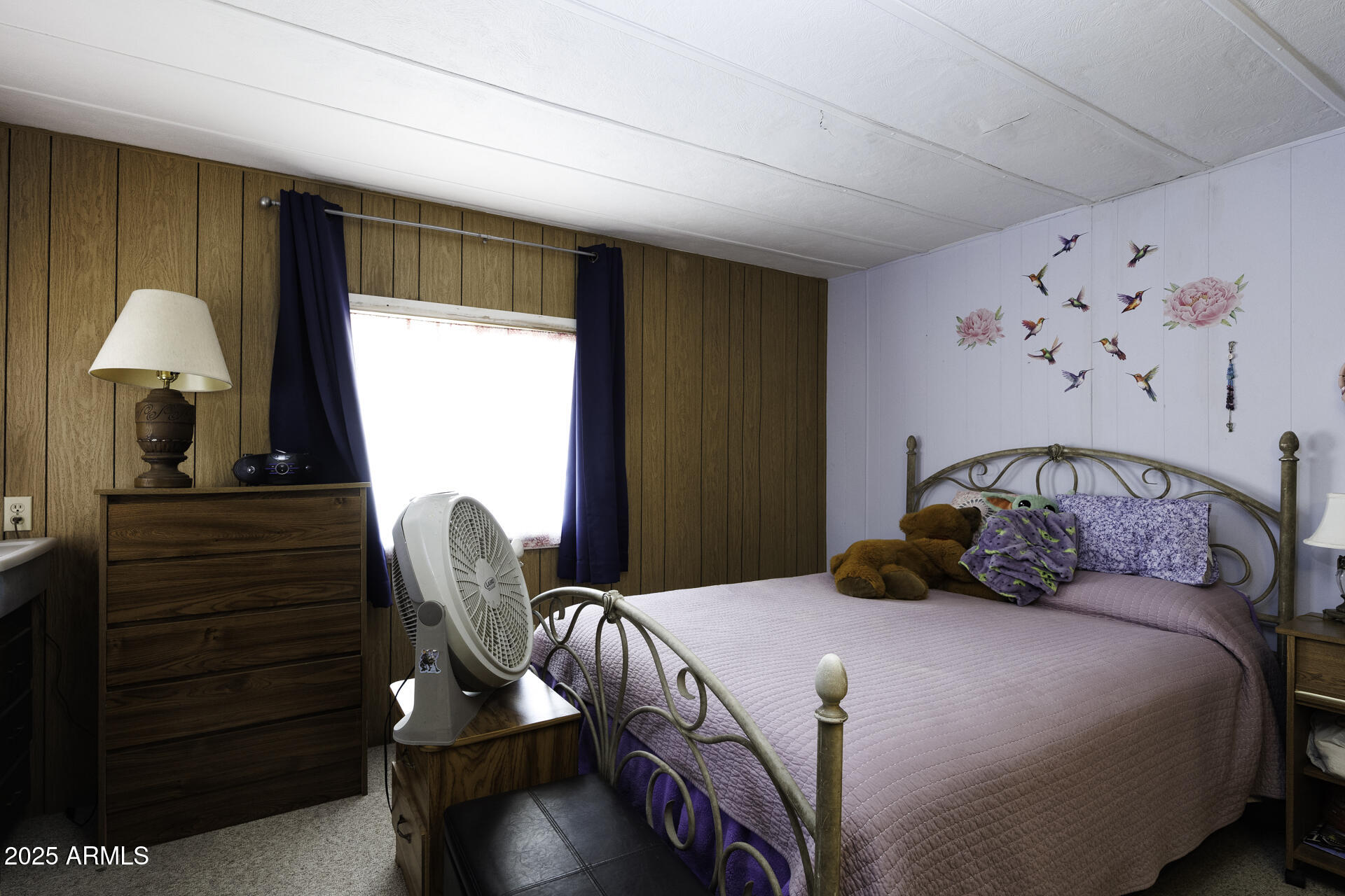 2100 North Trekell Road, Unit 347 Casa Grande, AZ 85122 - Photo 15 of 38 a bedroom with a bed and a chandelier