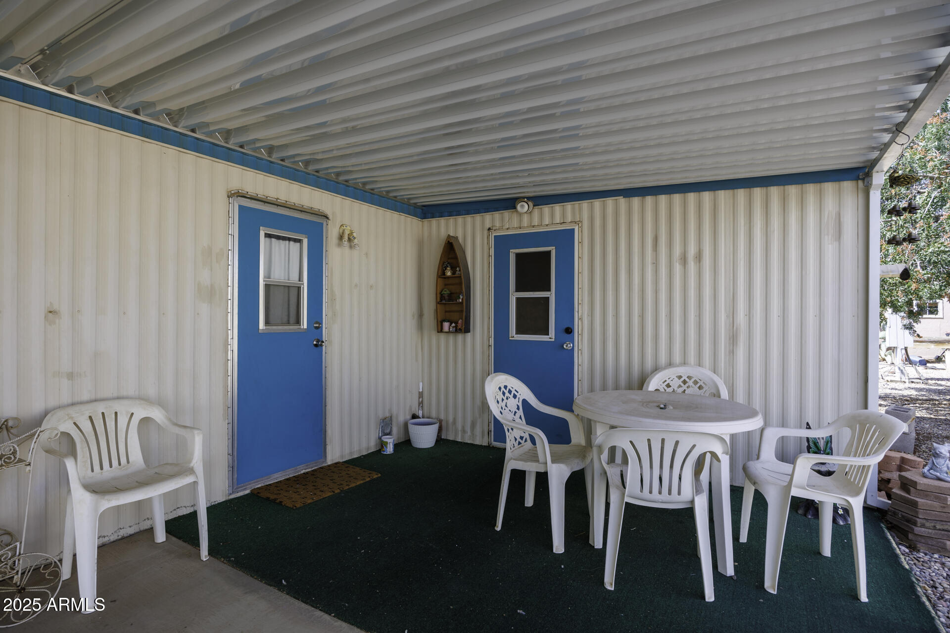 2100 North Trekell Road, Unit 347 Casa Grande, AZ 85122 - Photo 20 of 38 a view of a patio with table and chairs with wooden floor