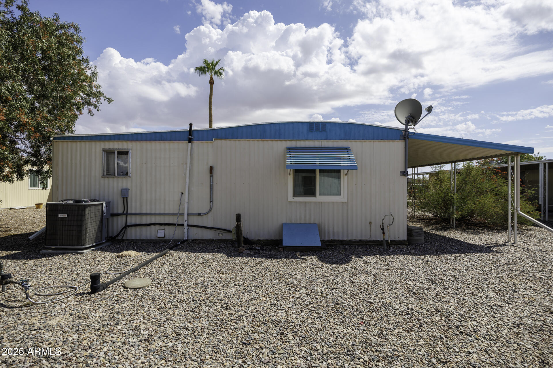 2100 North Trekell Road, Unit 347 Casa Grande, AZ 85122 - Photo 25 of 38 a front view of a house with garden