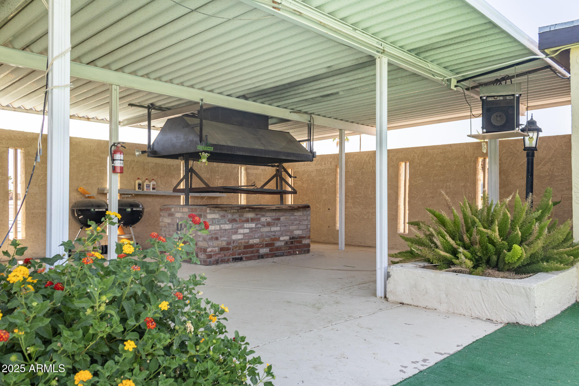 2100 North Trekell Road, Unit 347 Casa Grande, AZ 85122 - Photo 30 of 38 a view of a porch with potted plants