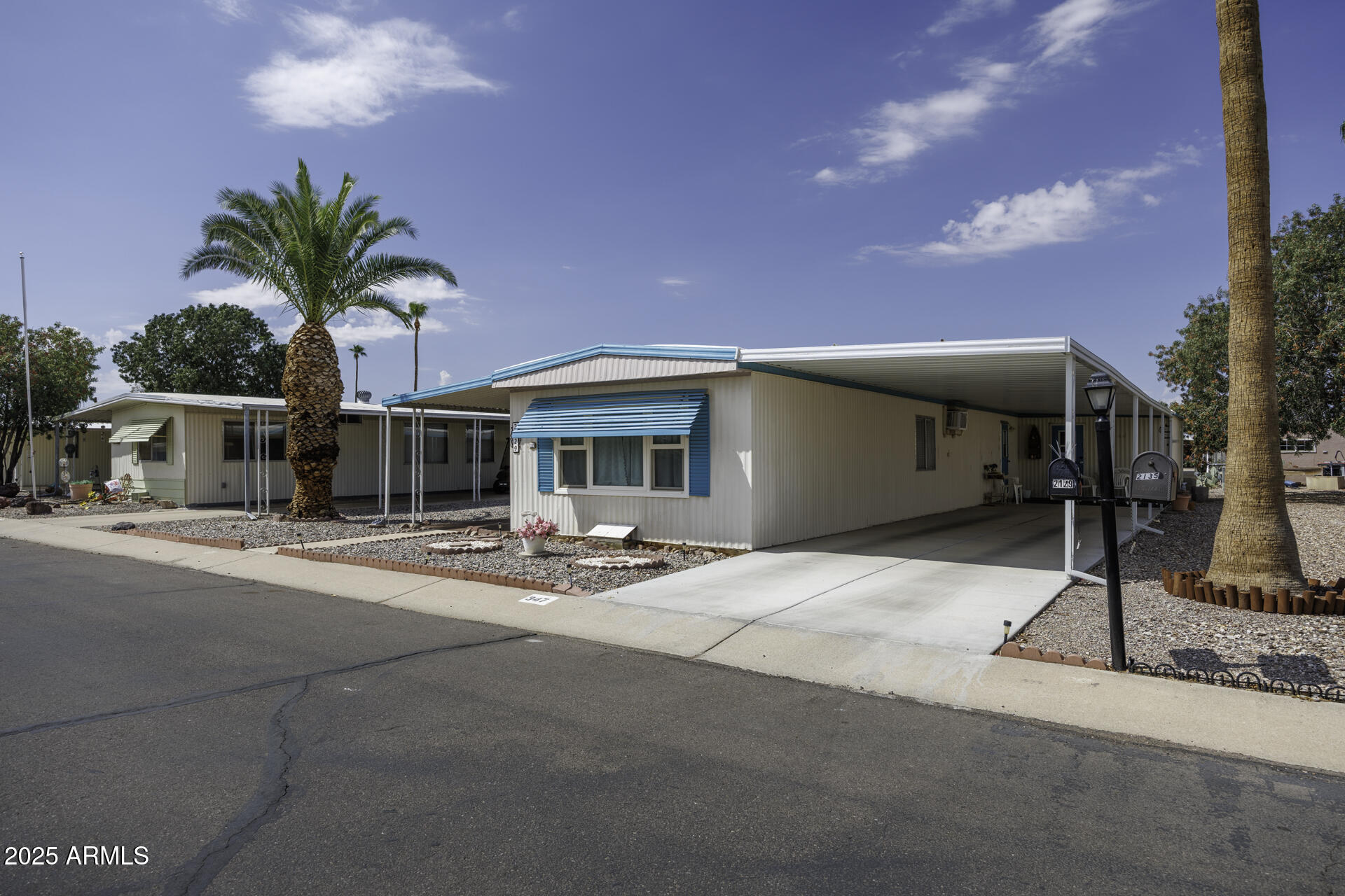2100 North Trekell Road, Unit 347 Casa Grande, AZ 85122 - Photo 3 of 38 a view of a house with outdoor space and palm tree