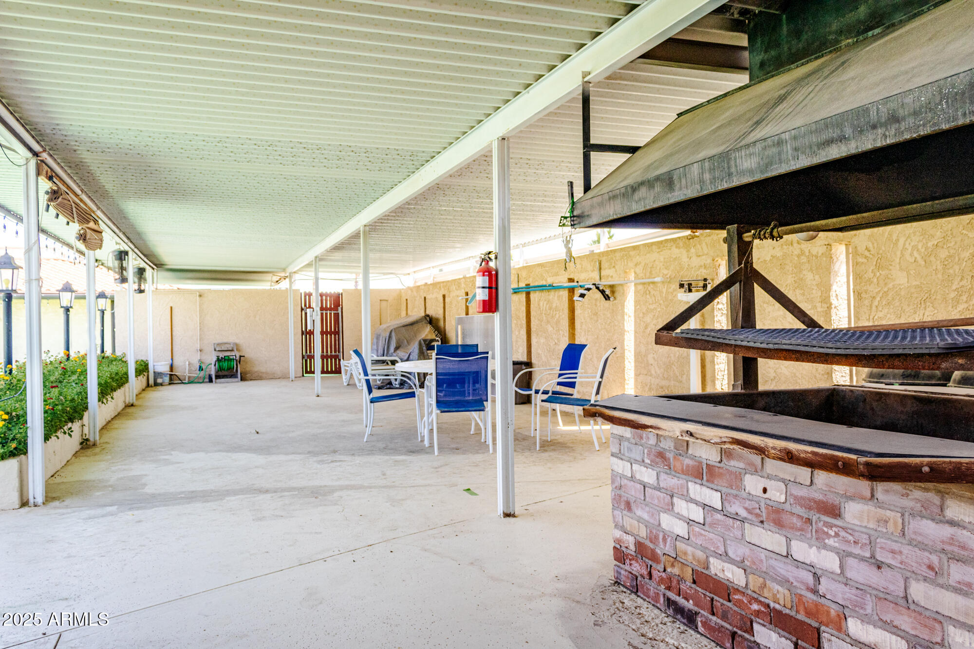 2100 North Trekell Road, Unit 347 Casa Grande, AZ 85122 - Photo 31 of 38 a building outdoor space with patio furniture and potted plants