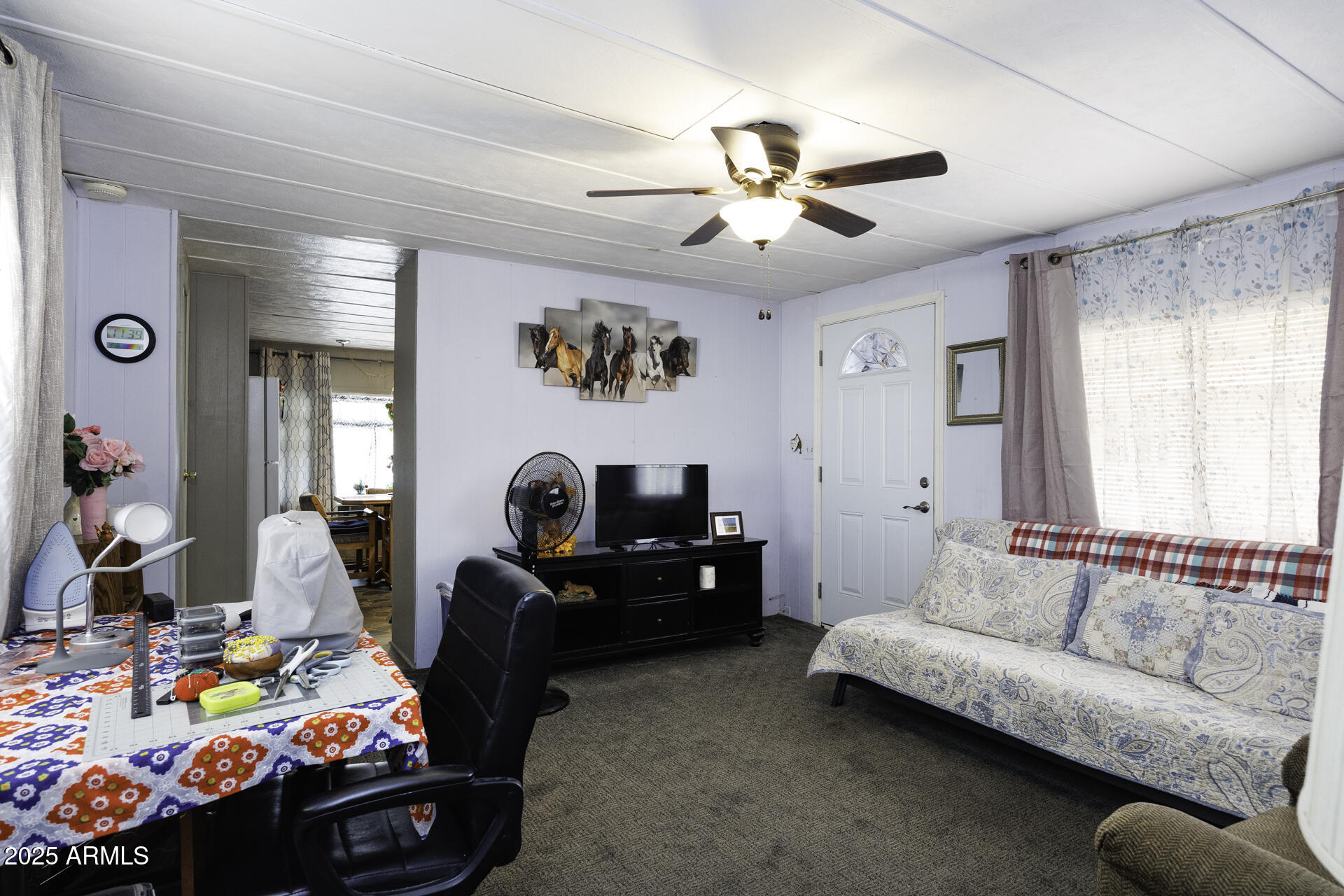 2100 North Trekell Road, Unit 347 Casa Grande, AZ 85122 - Photo 6 of 38 a living room with furniture and a flat screen tv