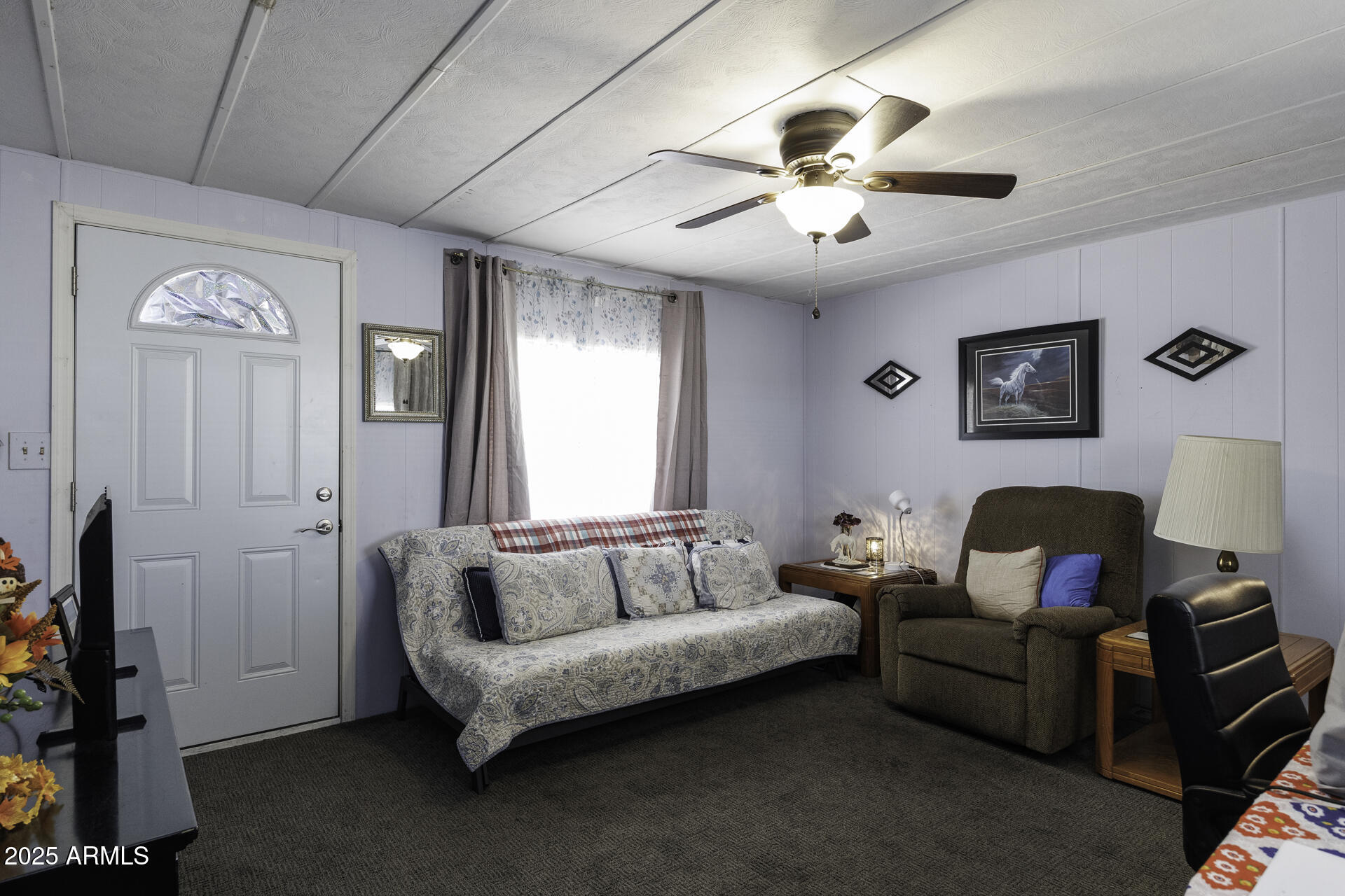 2100 North Trekell Road, Unit 347 Casa Grande, AZ 85122 - Photo 7 of 38 a living room with furniture and a chandelier