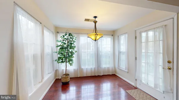 a view of an entryway with wooden floor
