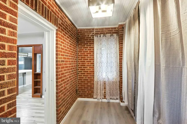 a view of a bathroom with a shower and a window