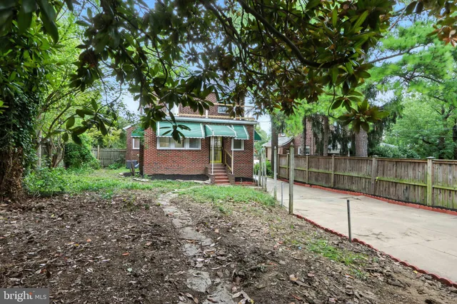 a backyard of a house with lots of green space