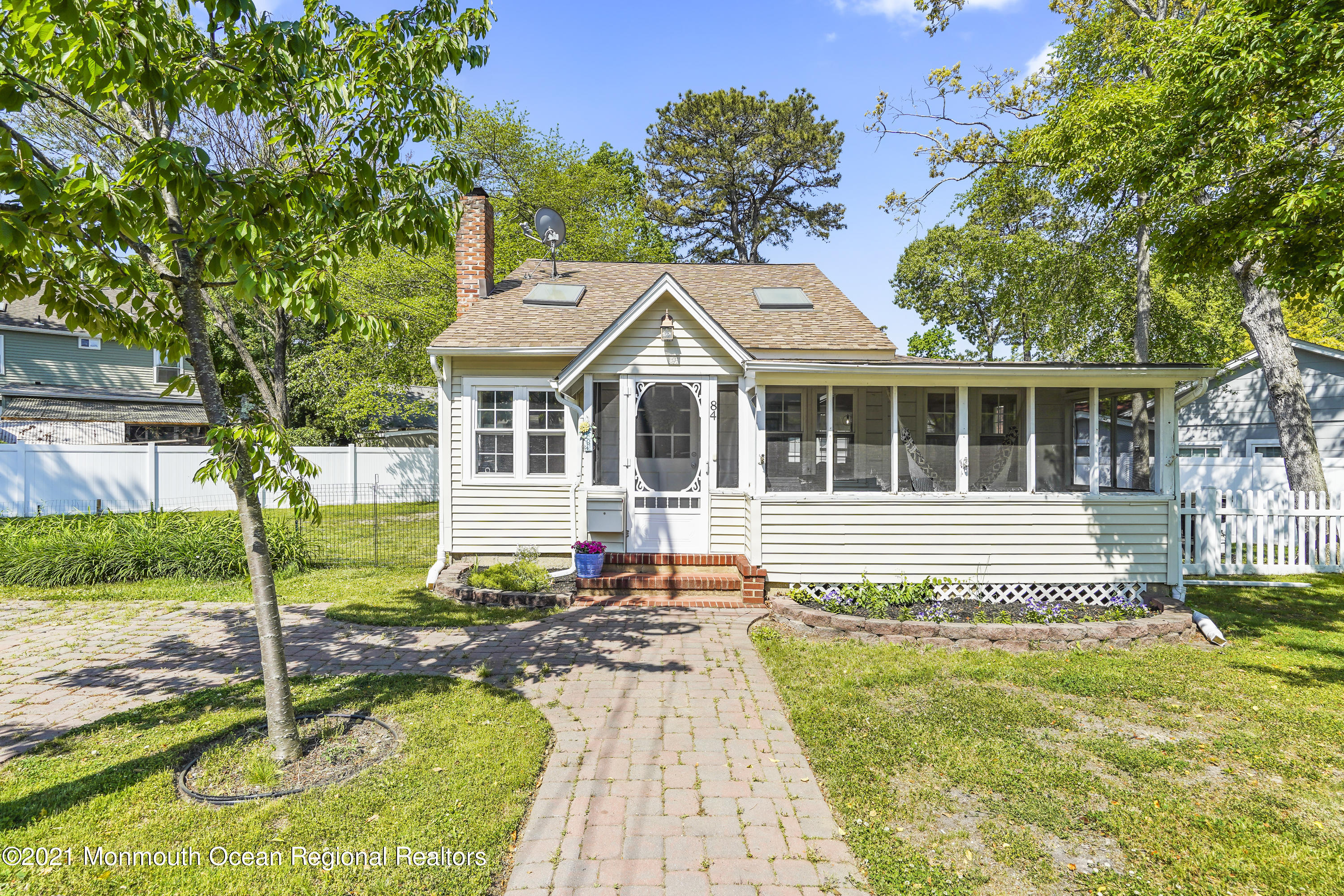 84 Breton Road Brick, NJ 08723 - Photo 1 of 19 a front view of a house with a yard