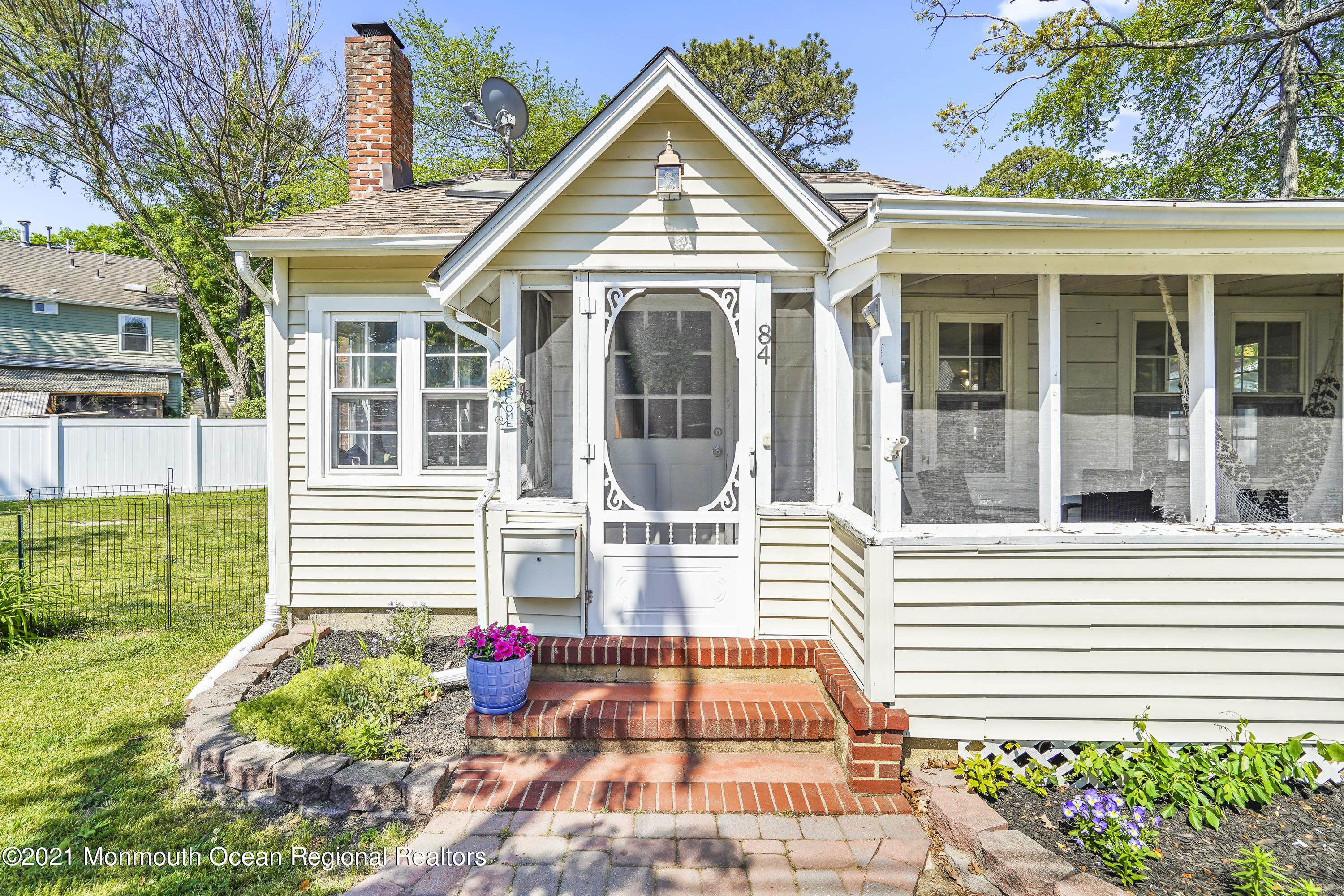 84 Breton Road Brick, NJ 08723 - Photo 2 of 19 a front view of a house with a yard