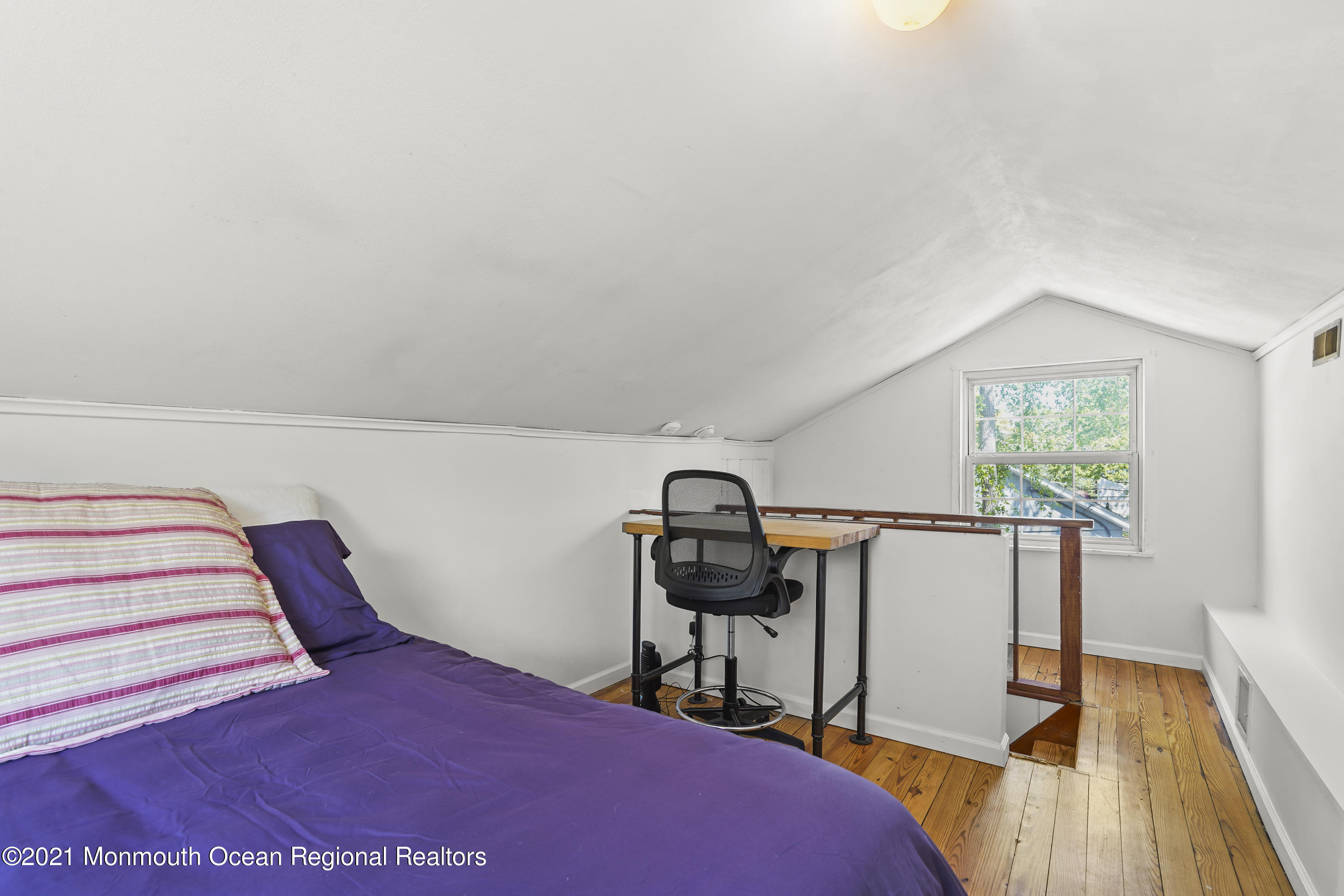 84 Breton Road Brick, NJ 08723 - Photo 16 of 19 a view of a bedroom with wooden floor and furniture