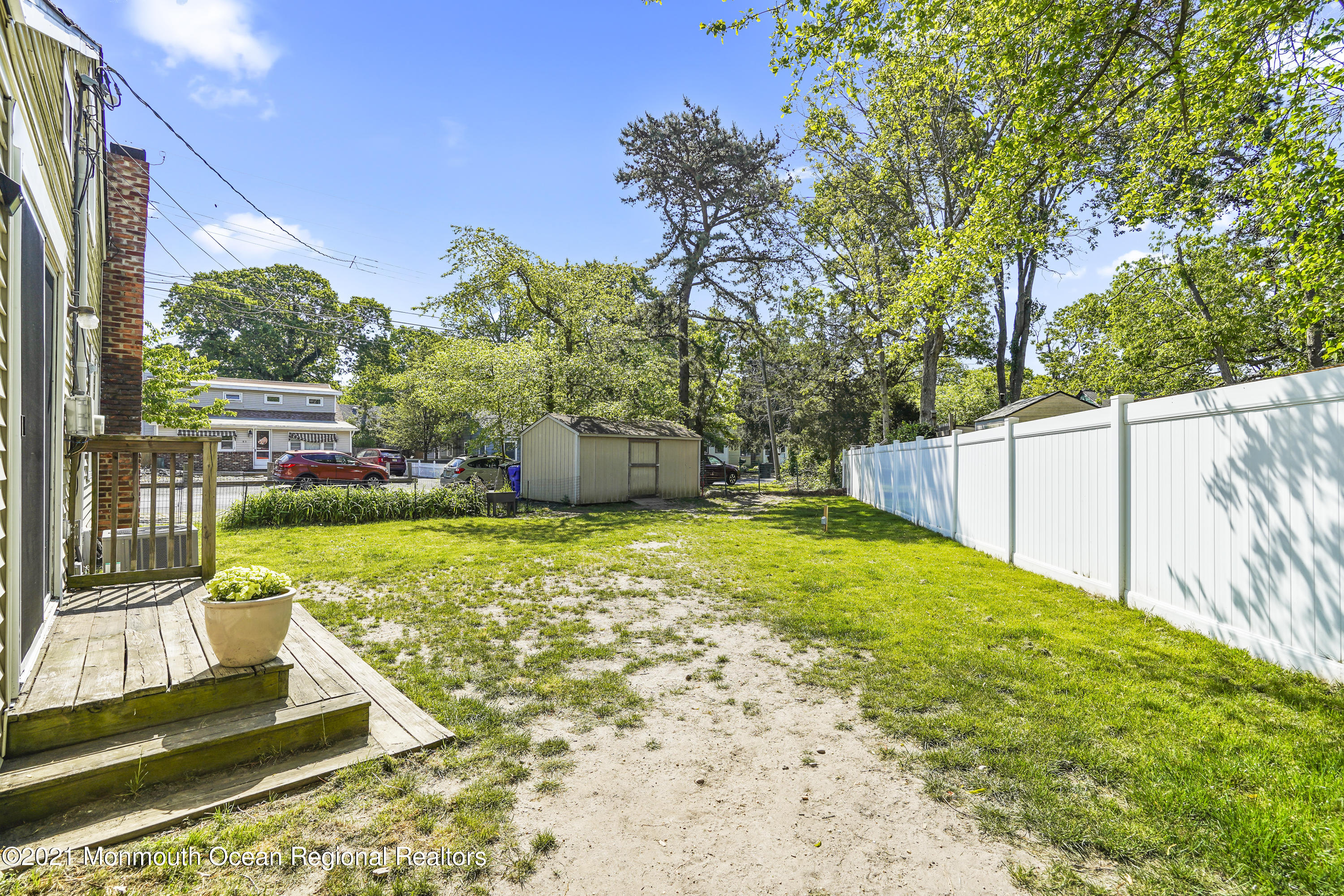 84 Breton Road Brick, NJ 08723 - Photo 18 of 19 a view of a backyard with a small cabin