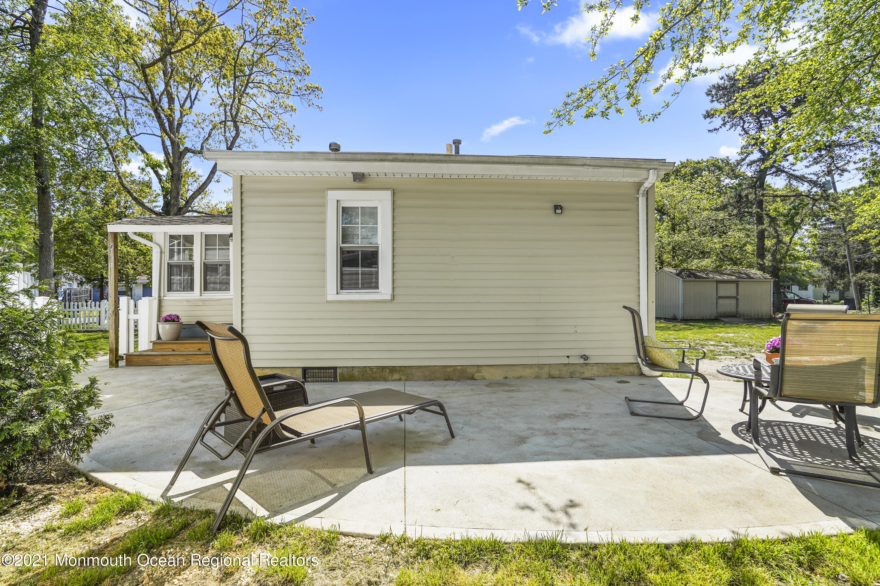 84 Breton Road Brick, NJ 08723 - Photo 19 of 19 a view of a backyard with a sitting area