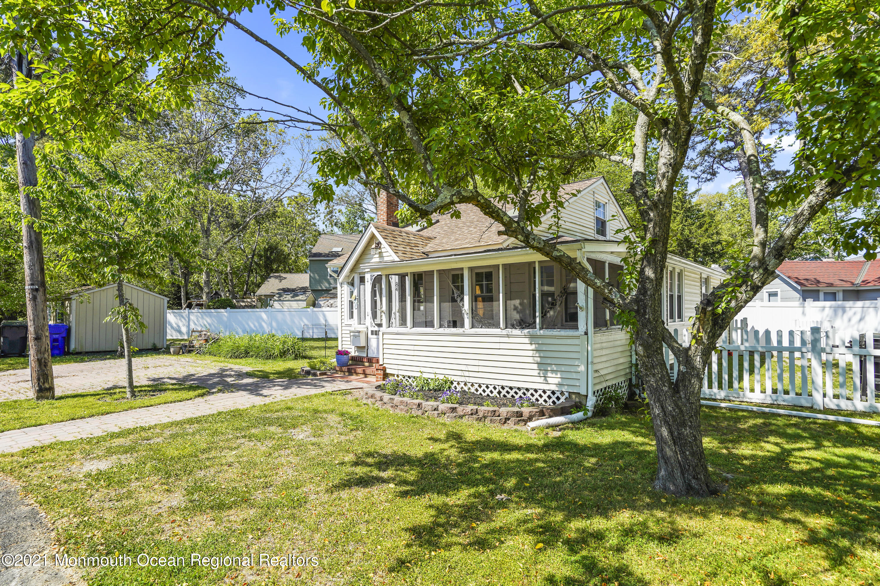84 Breton Road Brick, NJ 08723 - Photo 3 of 19 a front view of a house with a yard