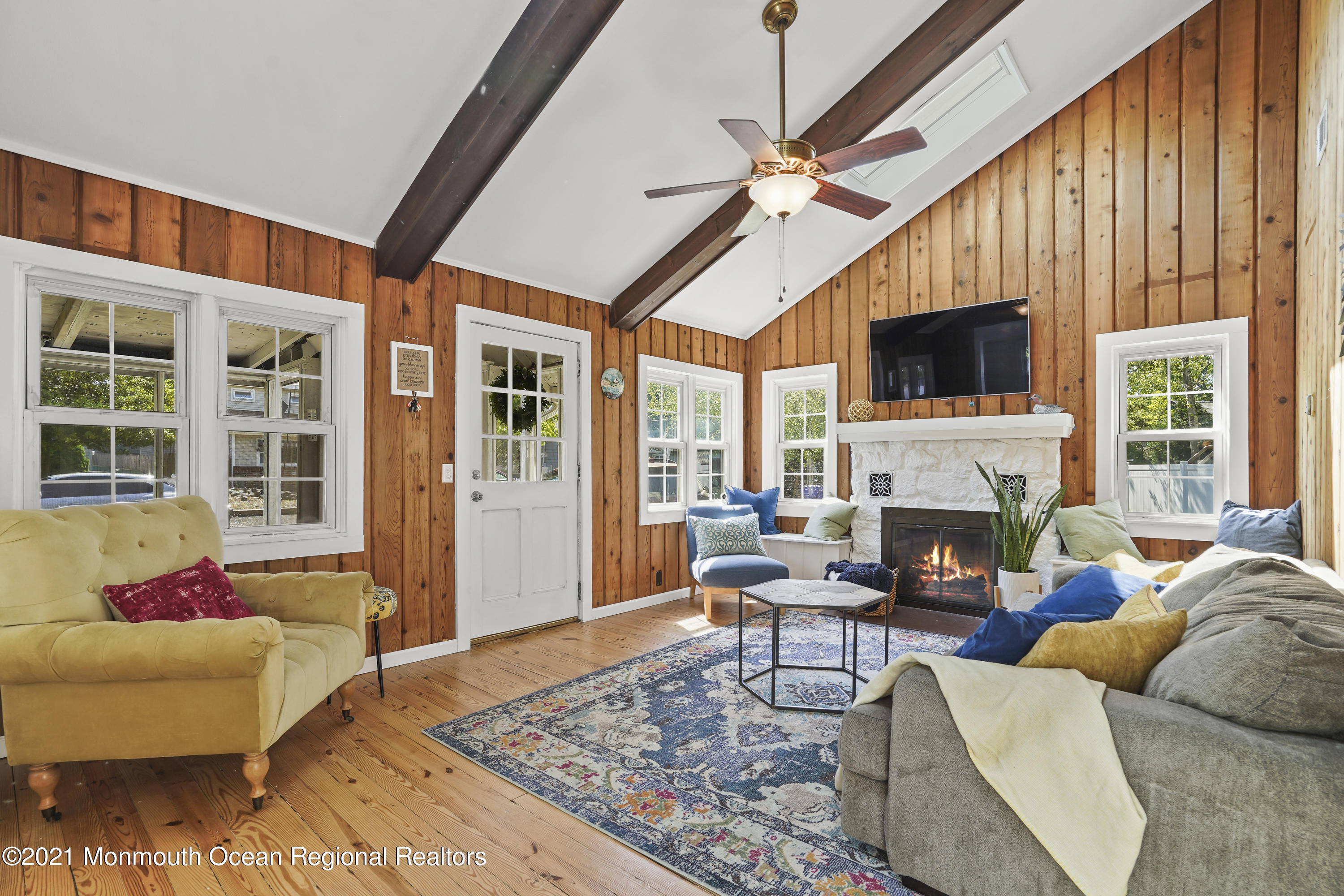 84 Breton Road Brick, NJ 08723 - Photo 6 of 19 a living room with furniture fireplace and flat screen tv
