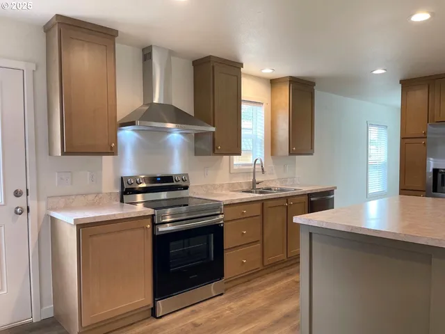 a kitchen with a stove and a sink
