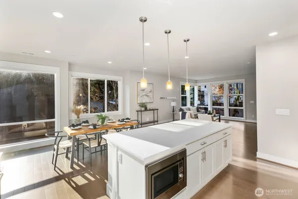 a open kitchen with stainless steel appliances granite countertop a sink and a stove