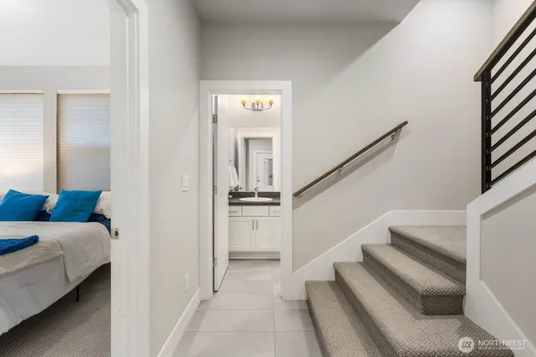 a view of a bedroom with furniture and staircase