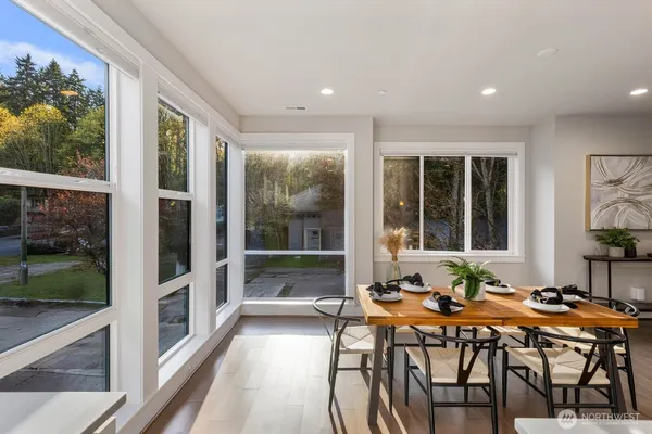 a outdoor dining space with furniture and garden view