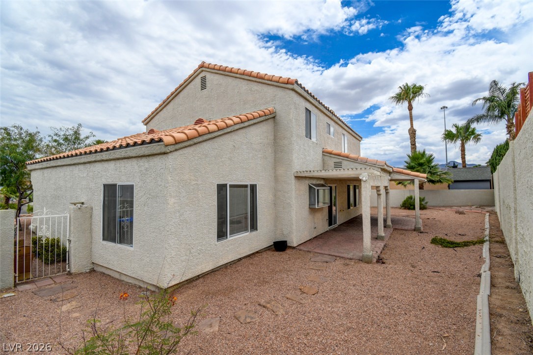 5 Tarryall Terrace Henderson, NV 89074 - Photo 40 of 44 A spacious backyard with a covered patio, ready for personalized landscaping visions.