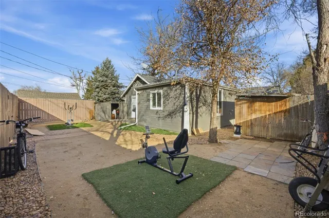 a view of a backyard with table and chairs