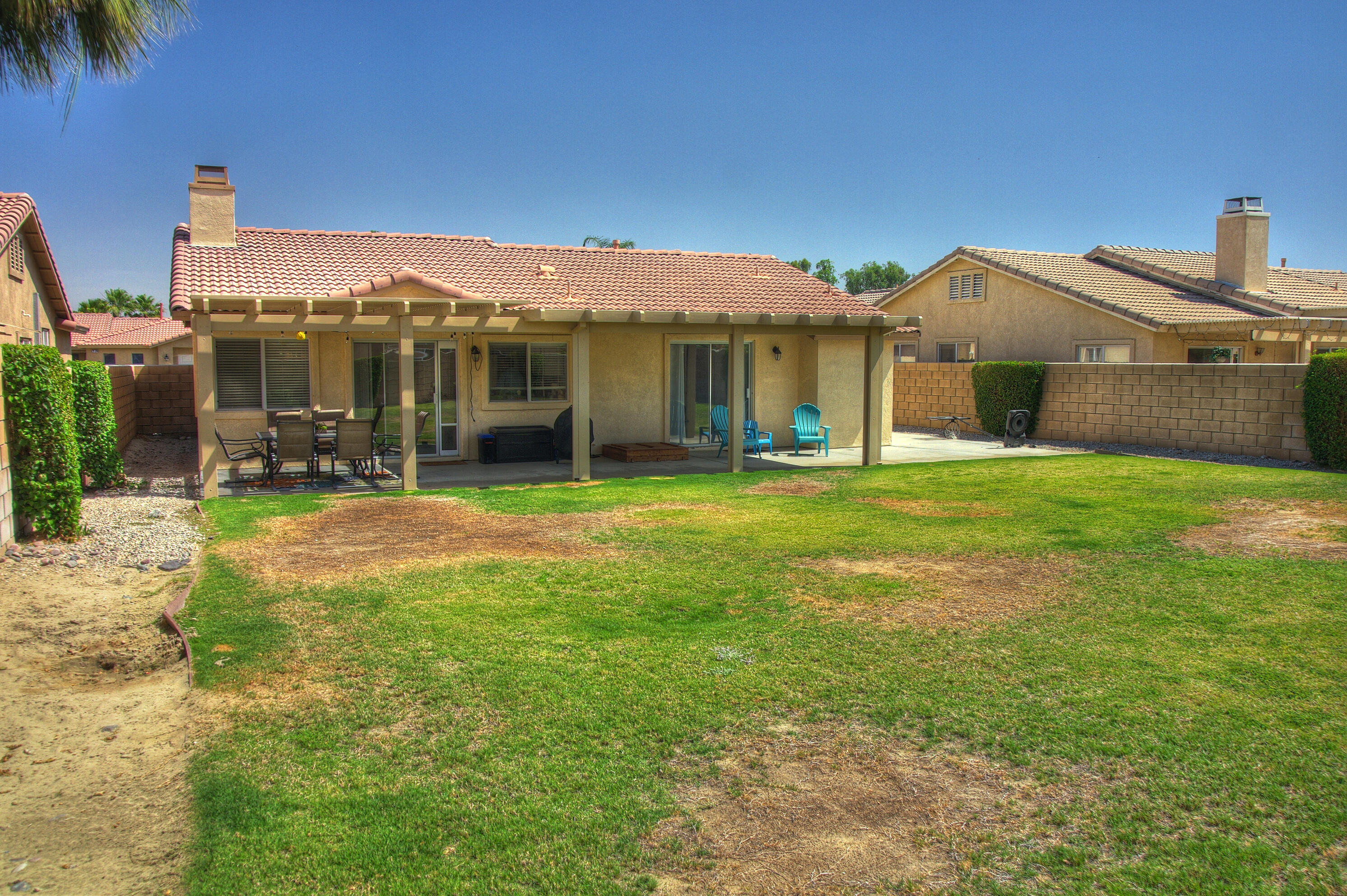 79379 Paseo Del Rey La Quinta, CA 92253 - Photo 21 of 24 a view of a house with a yard