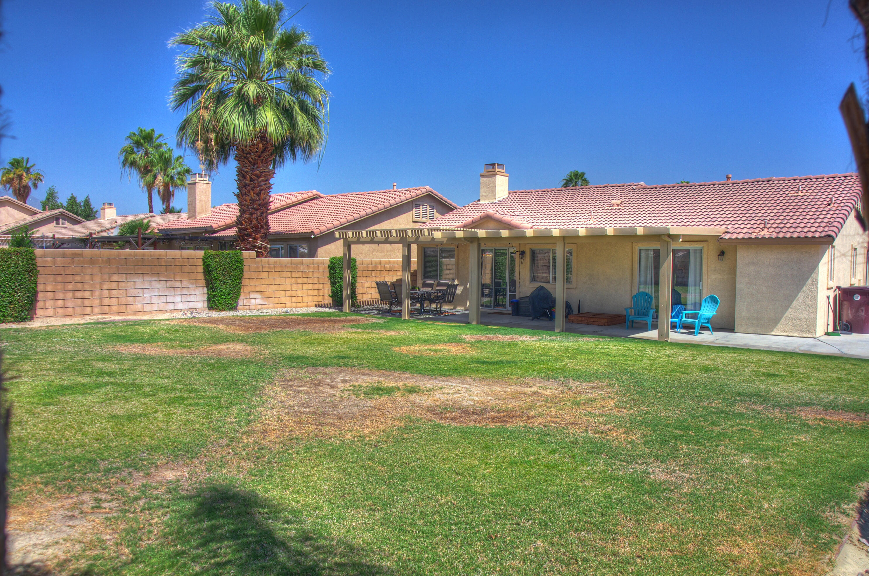 79379 Paseo Del Rey La Quinta, CA 92253 - Photo 22 of 24 a front view of a house with garden