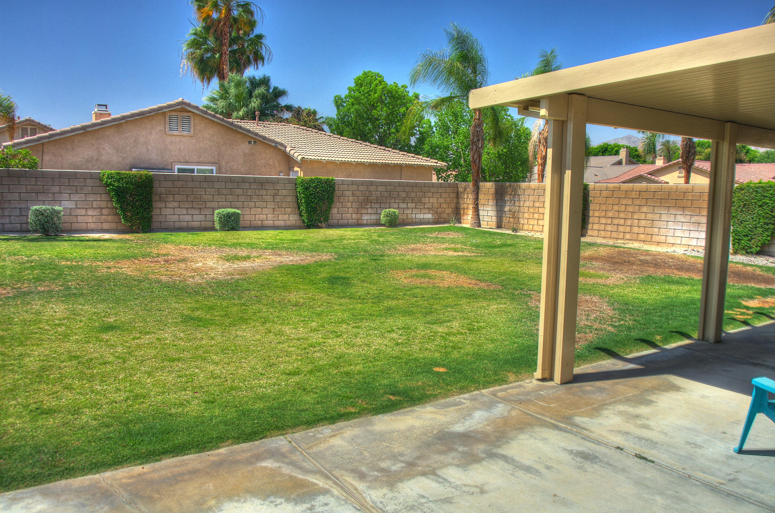79379 Paseo Del Rey La Quinta, CA 92253 - Photo 23 of 24 a front view of house with yard and green space