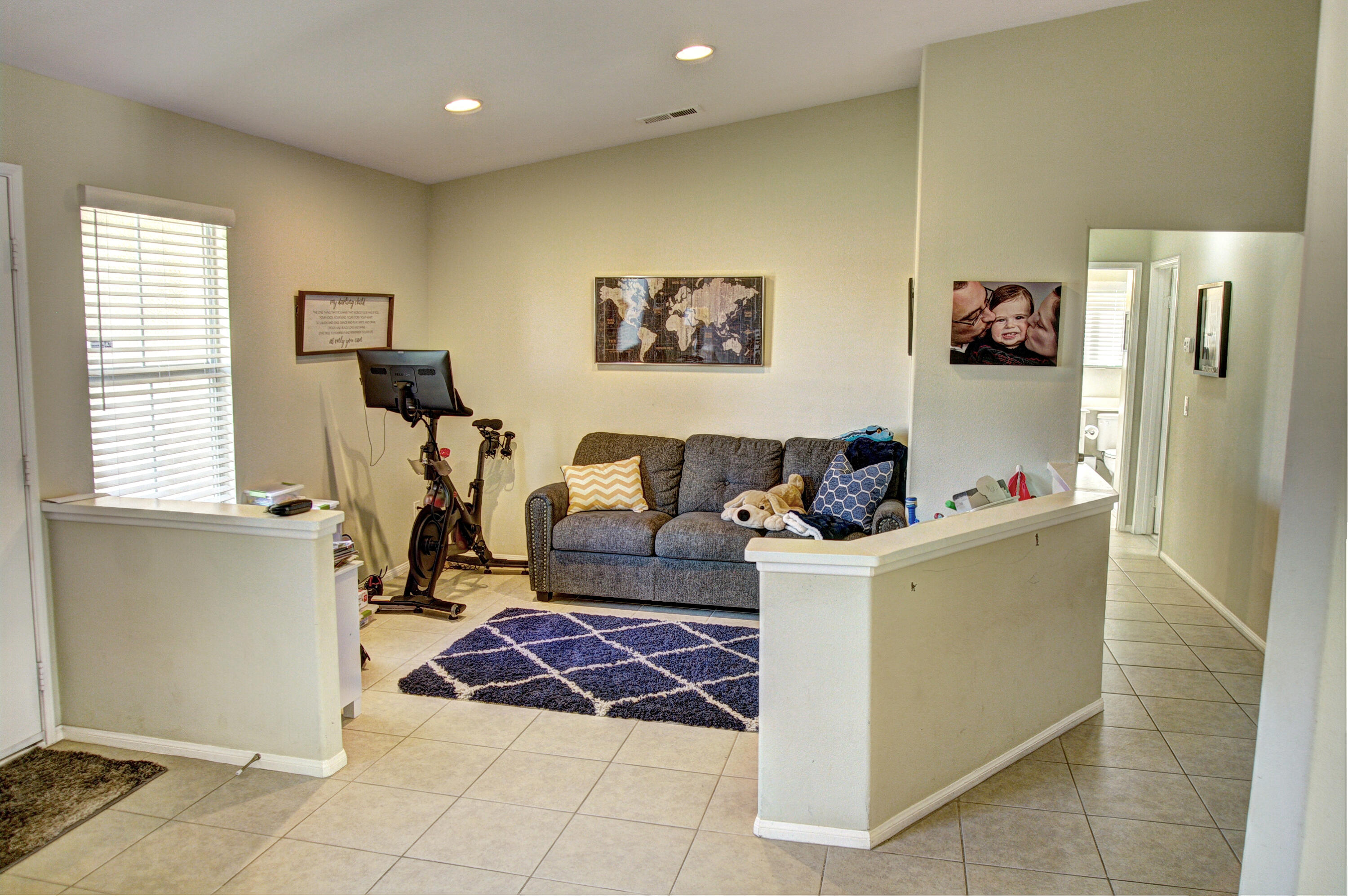 79379 Paseo Del Rey La Quinta, CA 92253 - Photo 4 of 24 a living room with a couch and a window