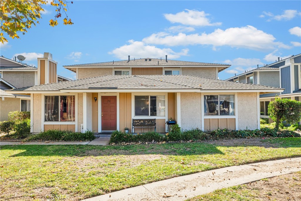 568 Spring Road, Unit 73 Moorpark, CA 93021 - Photo 1 of 1 a front view of a house with garden