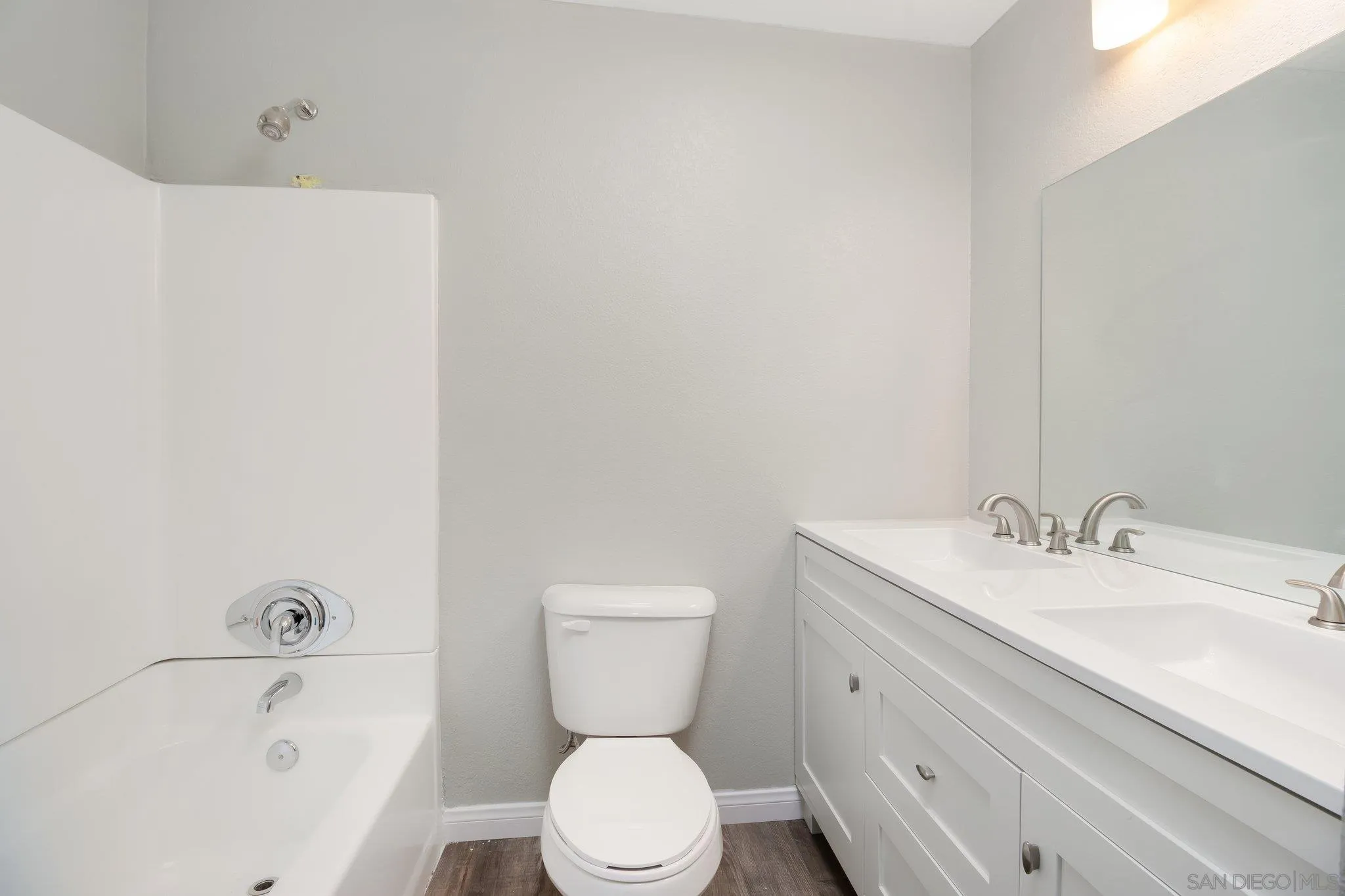 230 Zenith Street Chula Vista, CA 91911 - Photo 19 of 21 a bathroom with a sink a toilet and bathtub