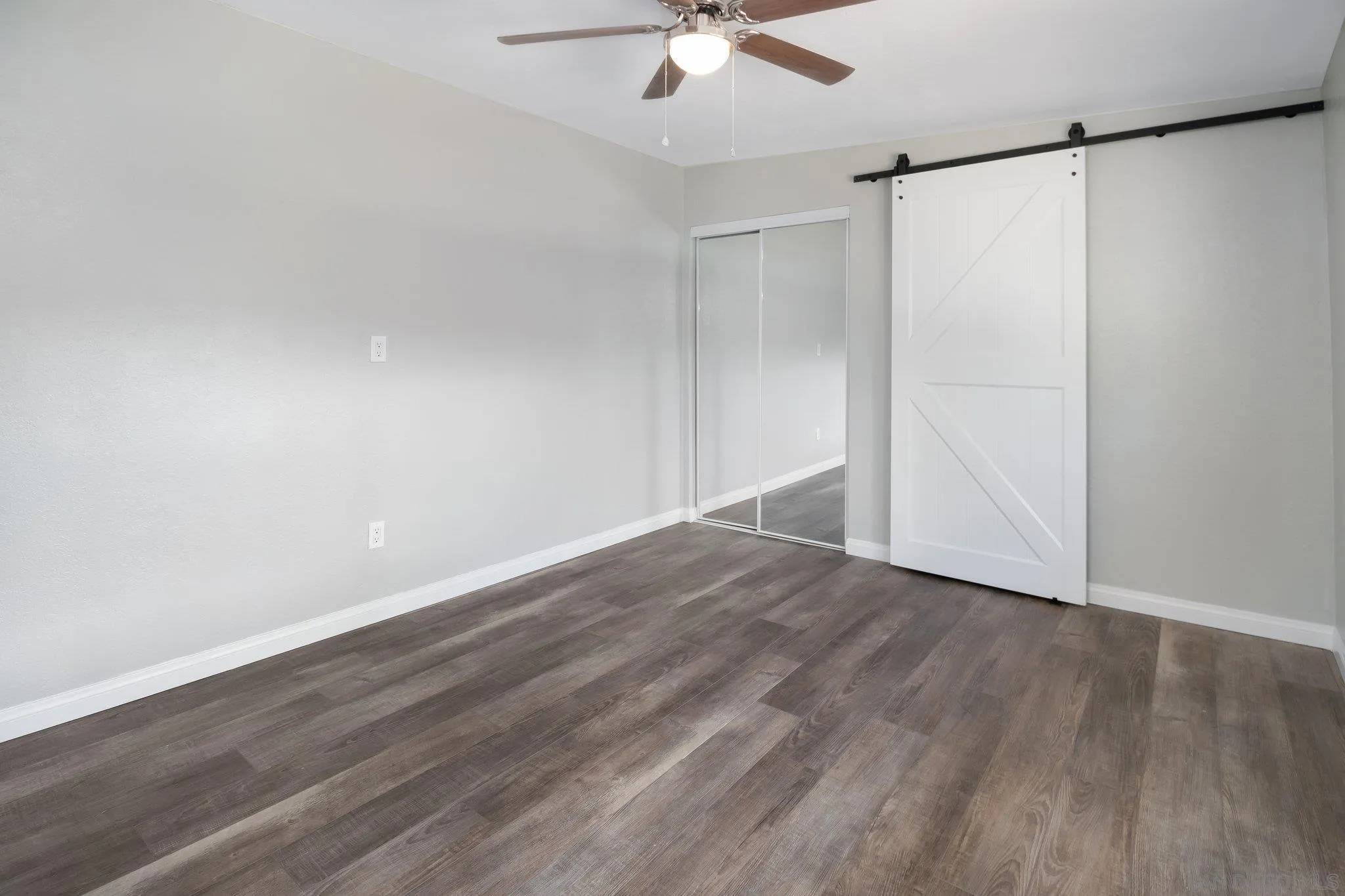 230 Zenith Street Chula Vista, CA 91911 - Photo 20 of 21 a view of an empty room with wooden floor