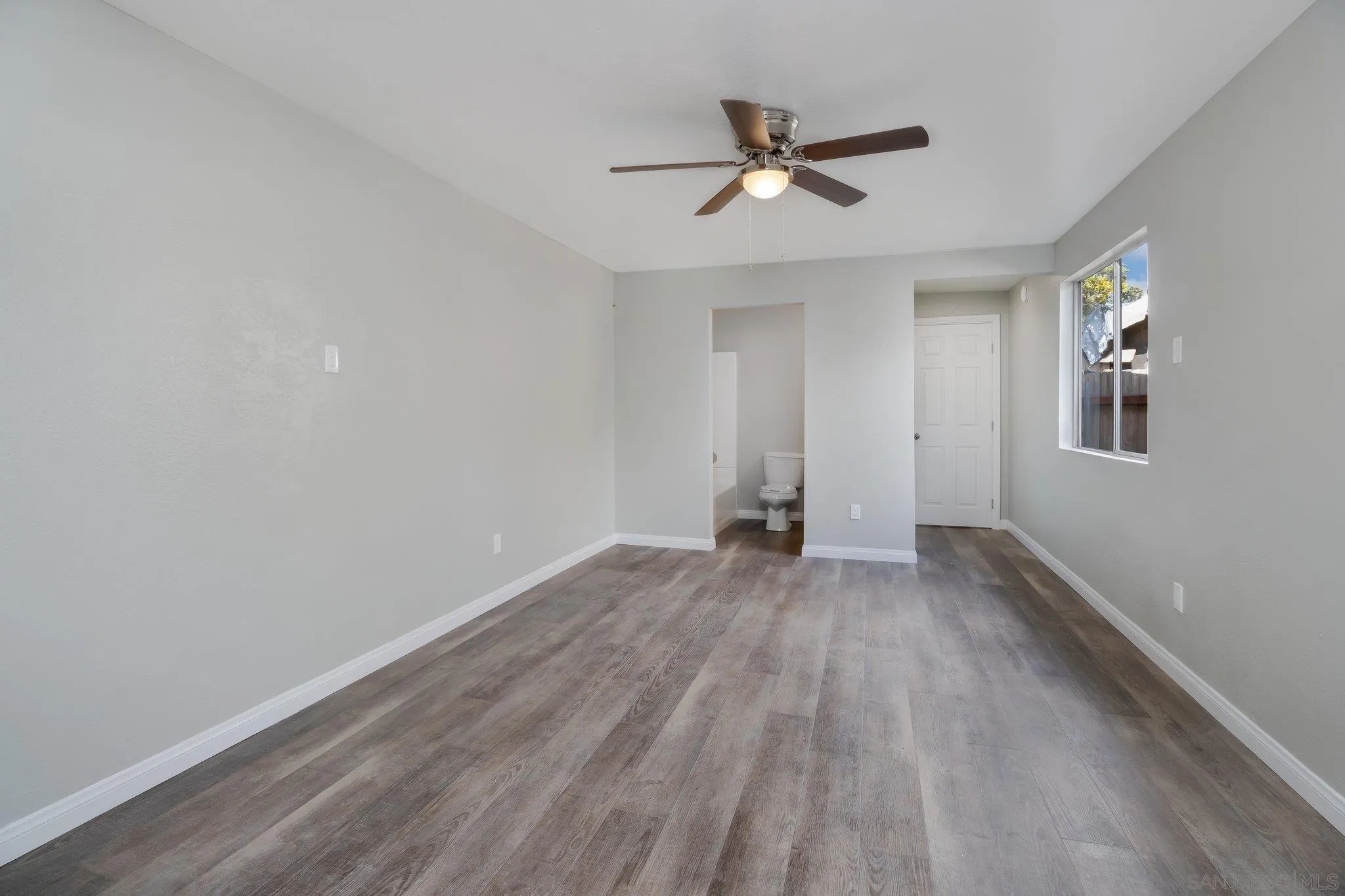 230 Zenith Street Chula Vista, CA 91911 - Photo 21 of 21 wooden floor in an empty room with a window